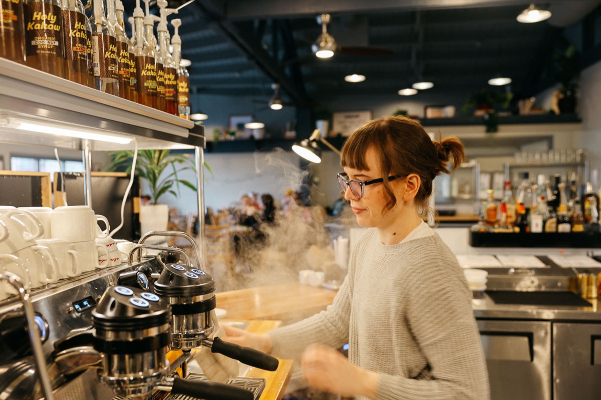 Barista at the espresso machine at Bodhi Coffee