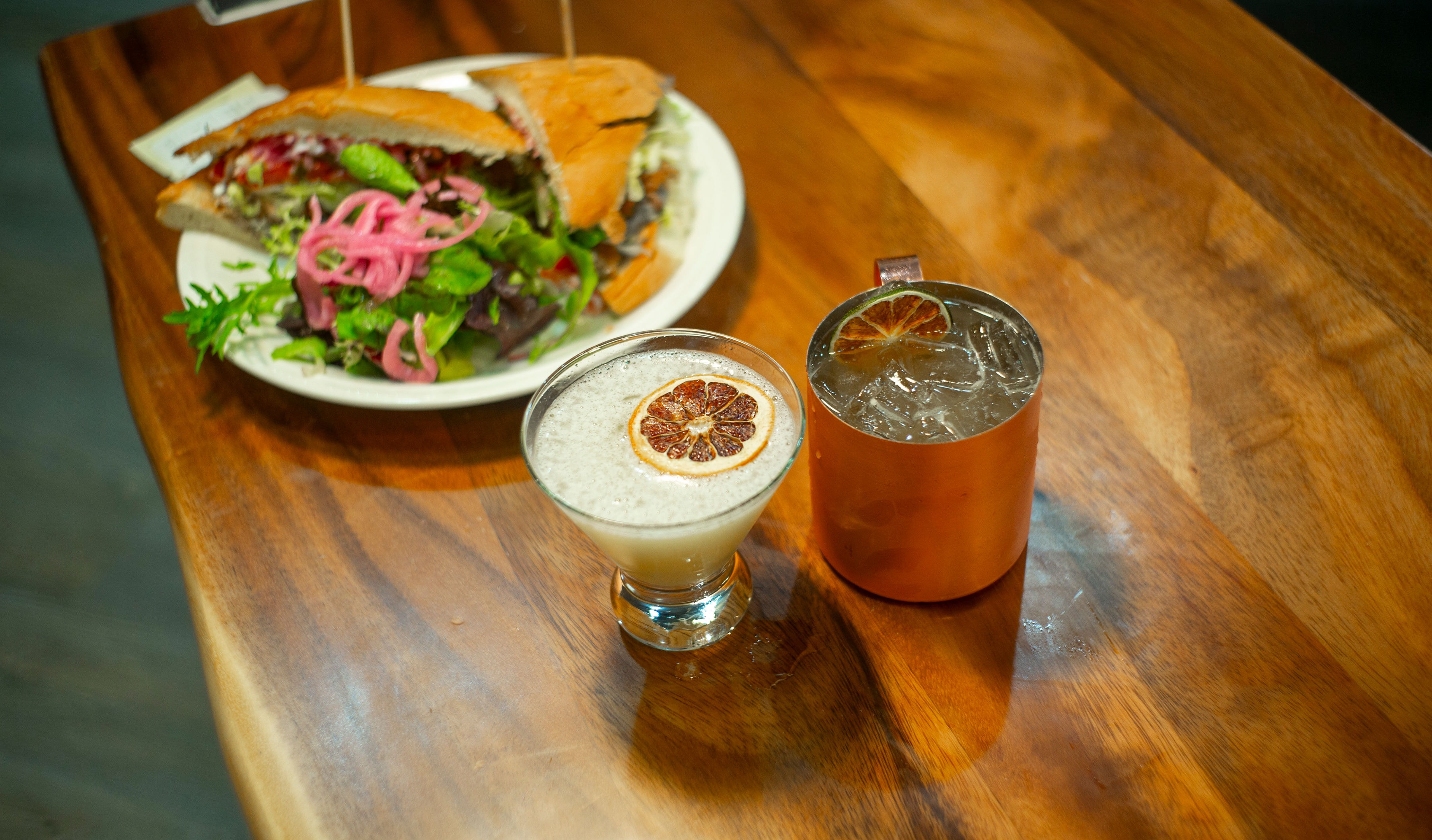 Bartender with cocktail at Bodhi Bistro
